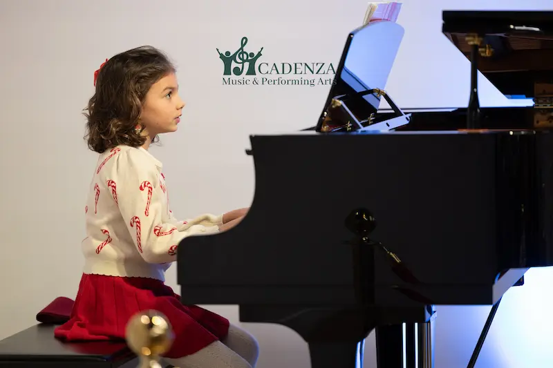 Young Student plays Piano Lesson