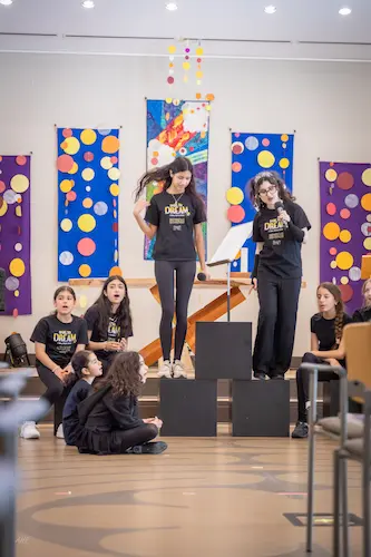 Talented young performers delivering a captivating theatrical performance in Dare to Dream