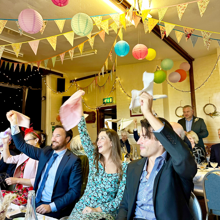 Wedding party celebrations in a village hall