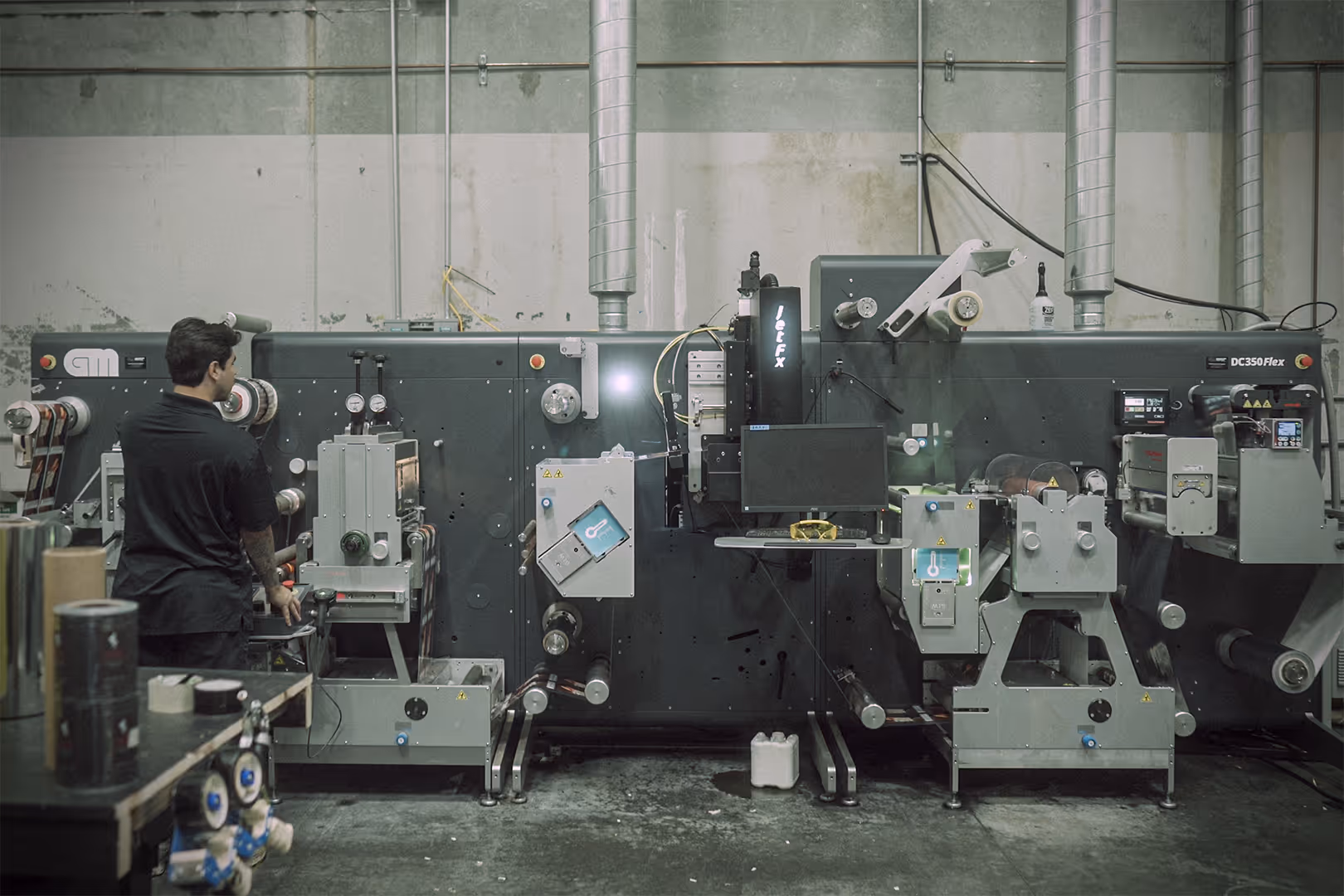 An operator at our GM DC350Flex label finisher.