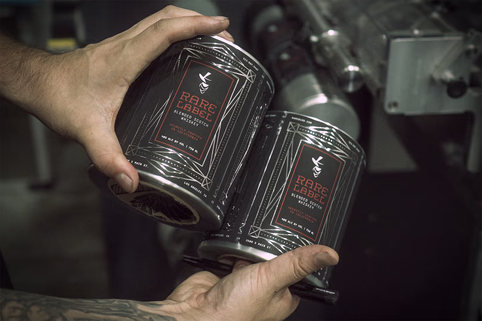 Black label for scotch whiskey called Rare Label in red text with silver foil stamping