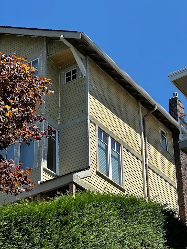 Exterior trim repair on a Bellevue home showing restored wood trim and freshly painted siding