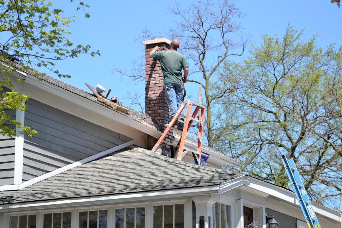 Chimney wood rot repairing on a Bellevue home's chimney chase