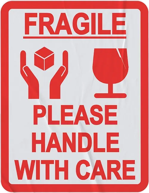Red and white sticker reading Fragile Please Handle With Care with hands and a wine glass icon