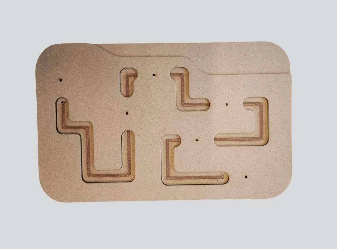 Wooden puzzle board with angular cutouts in light brown wood