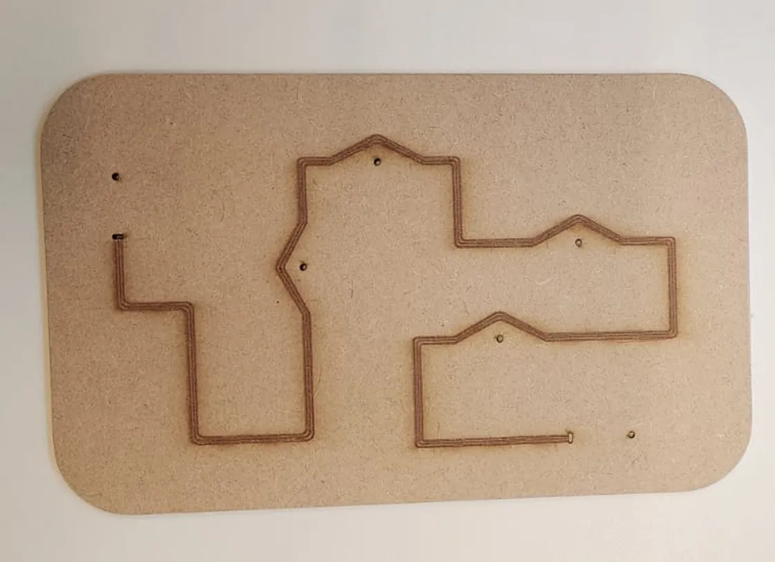 Wooden board with a narrow zigzag path cut into the surface