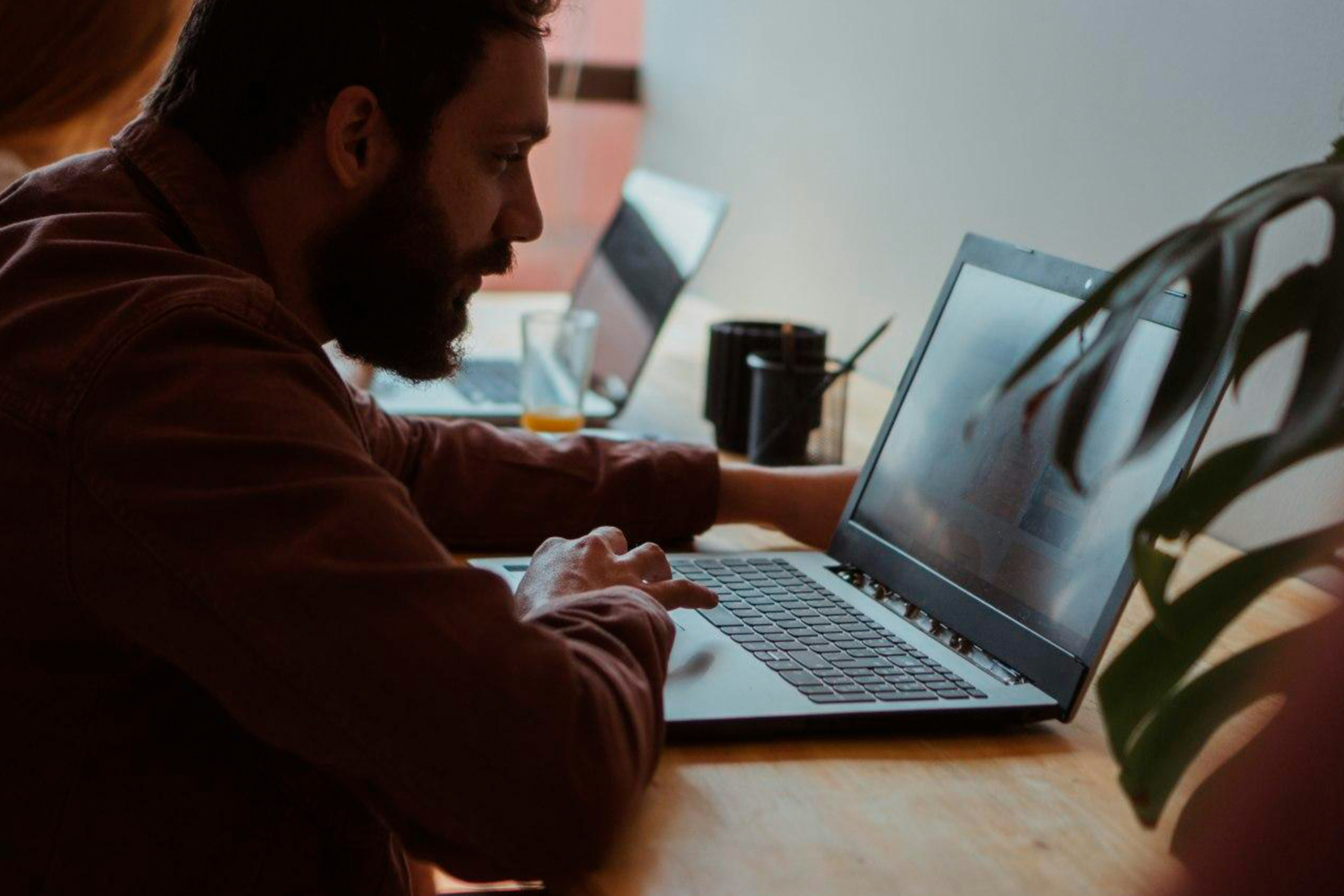 man working on laptop -  Formative Assessment Using Technology