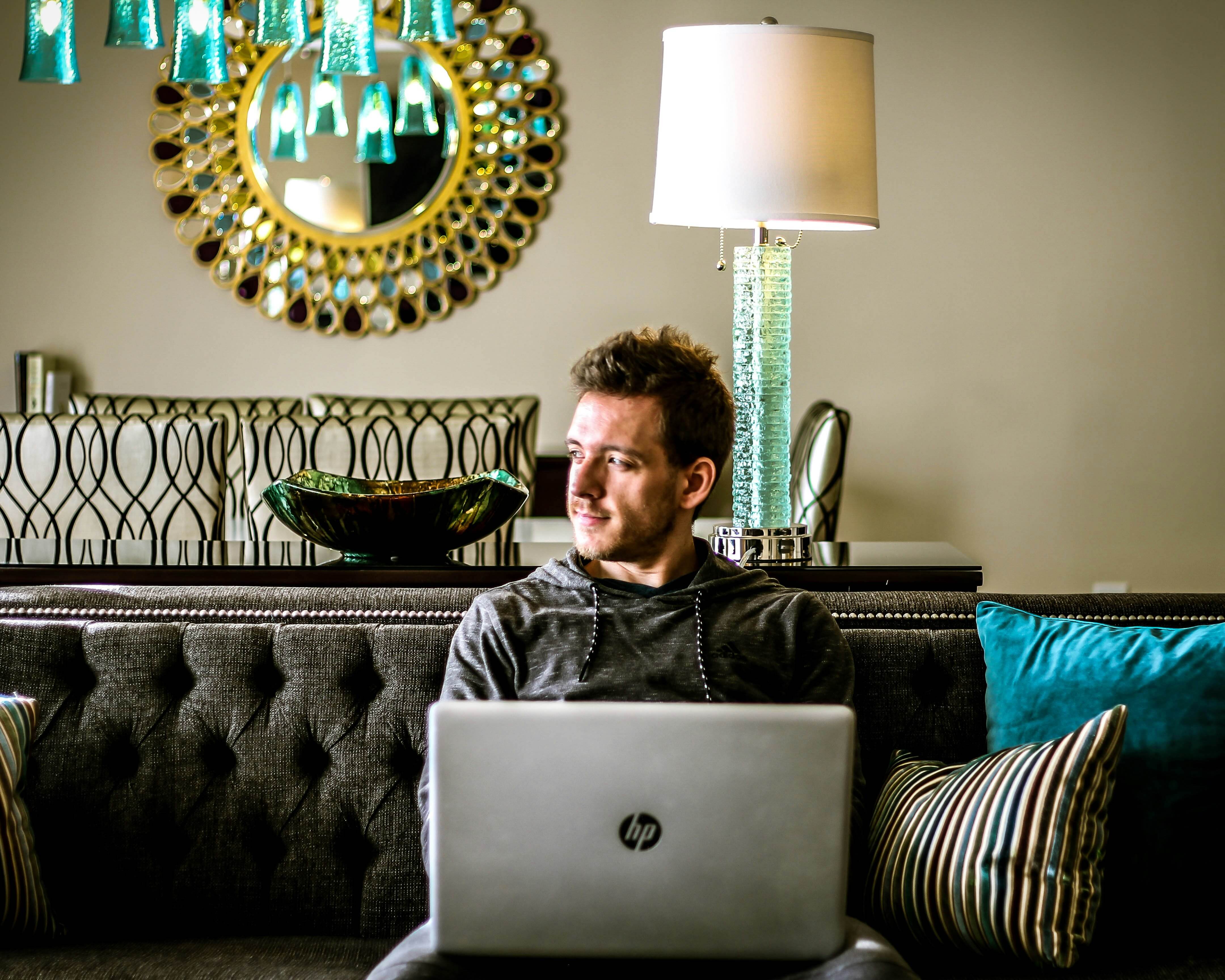 man sitting on laptop and working on laptop - AI in Assessment