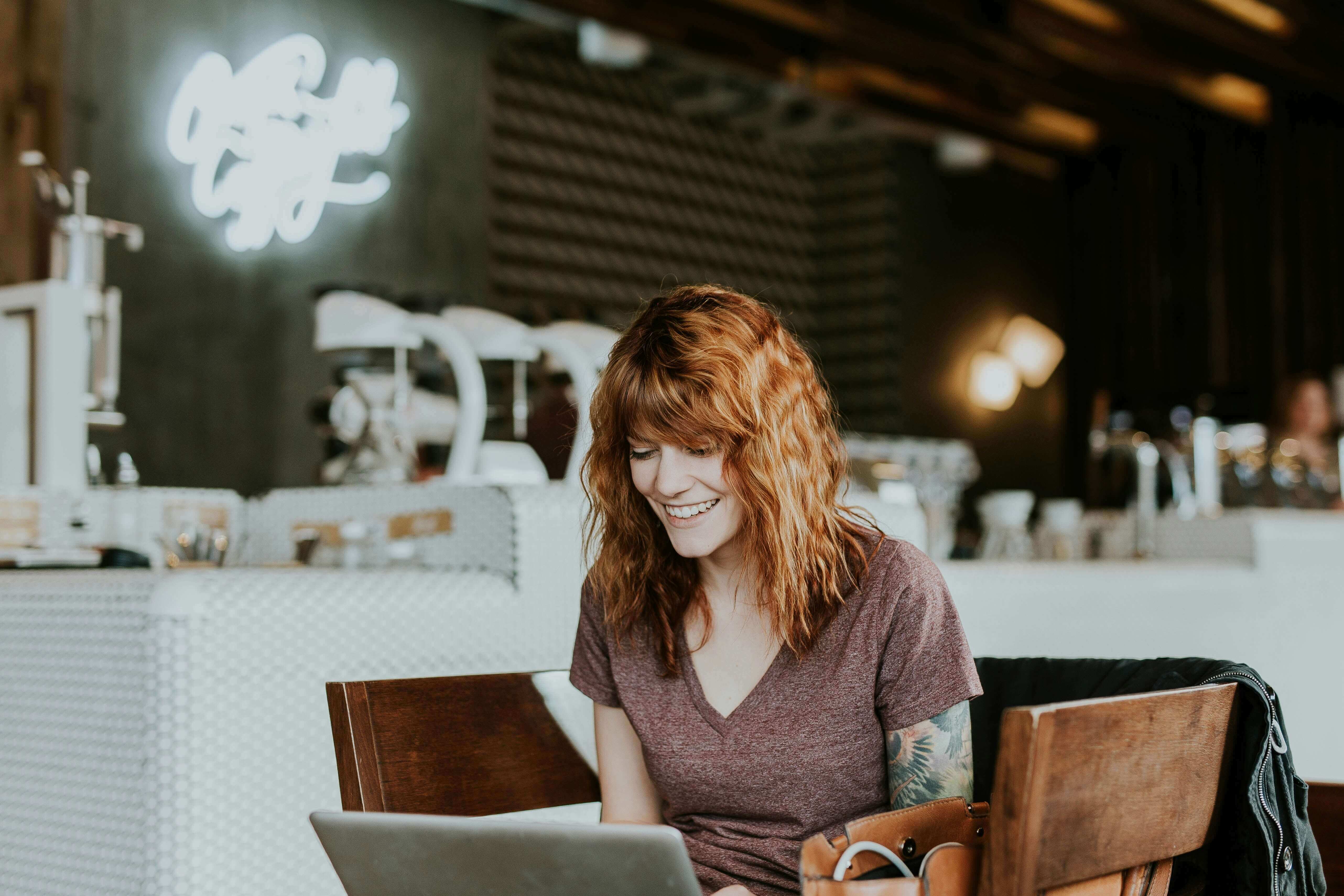 woman working on a laptop - Online Feedback Tools