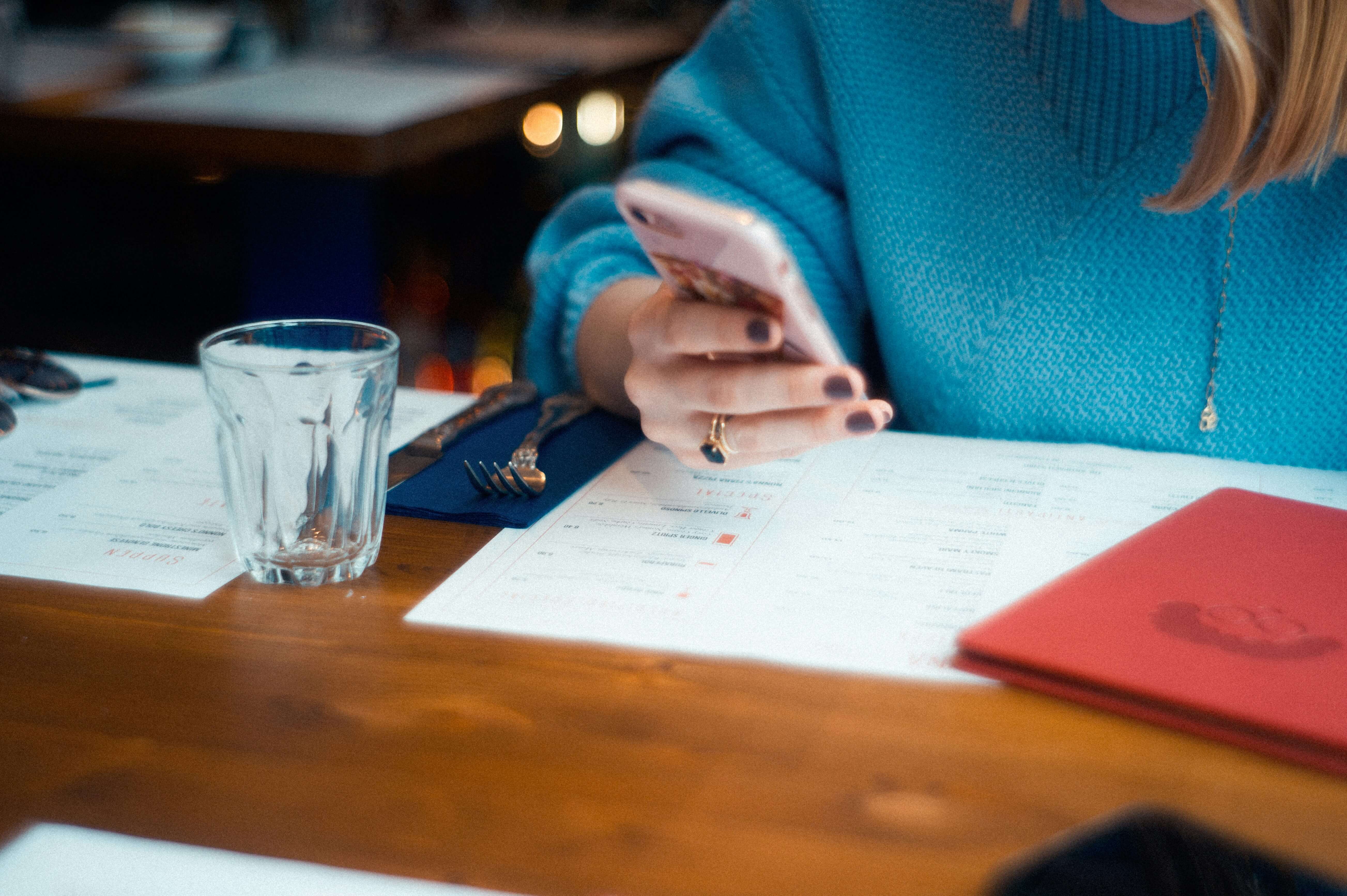 woman with papers infront of her - Essay Grading Rubric