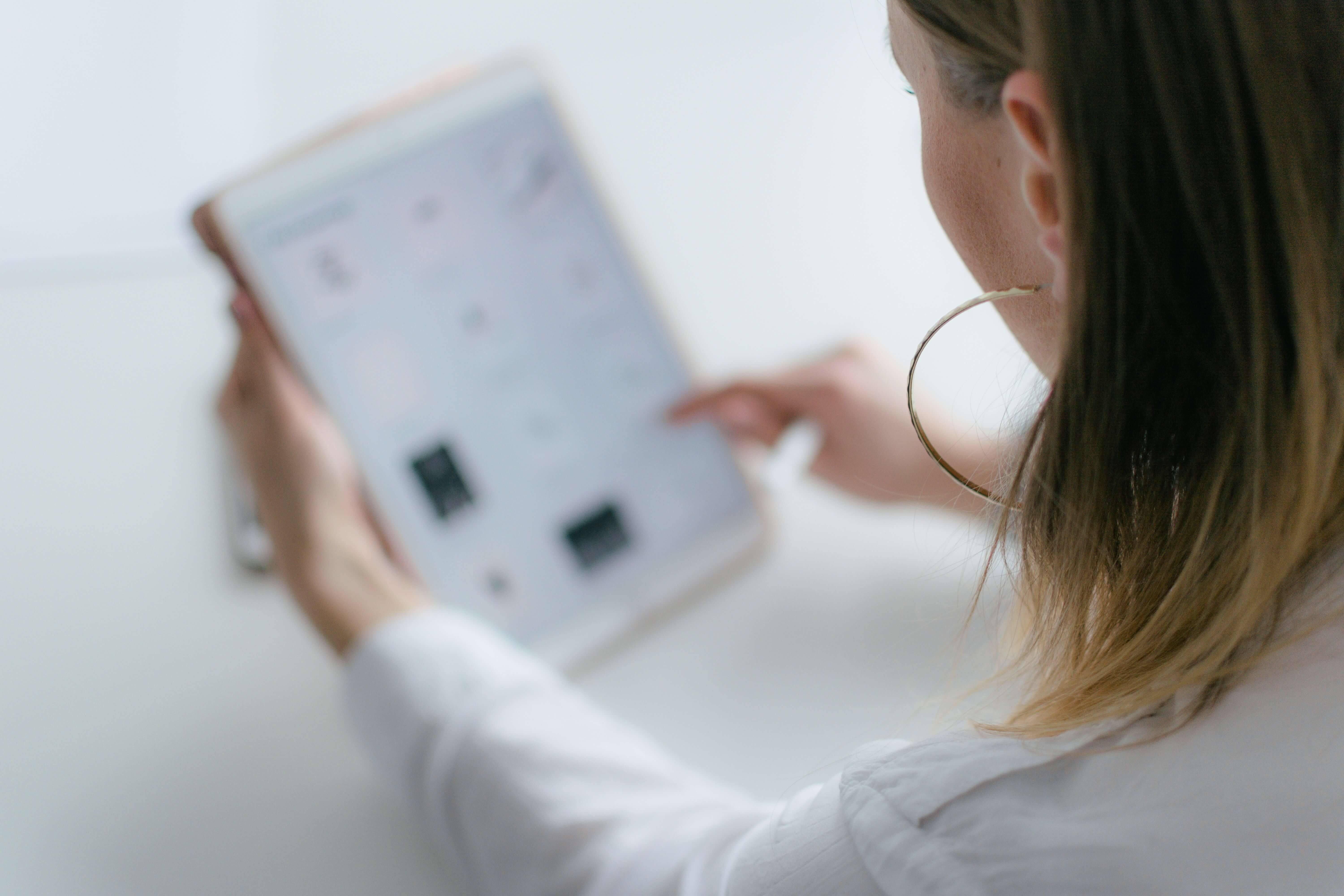 woman using an app for Essay Grading Rubric