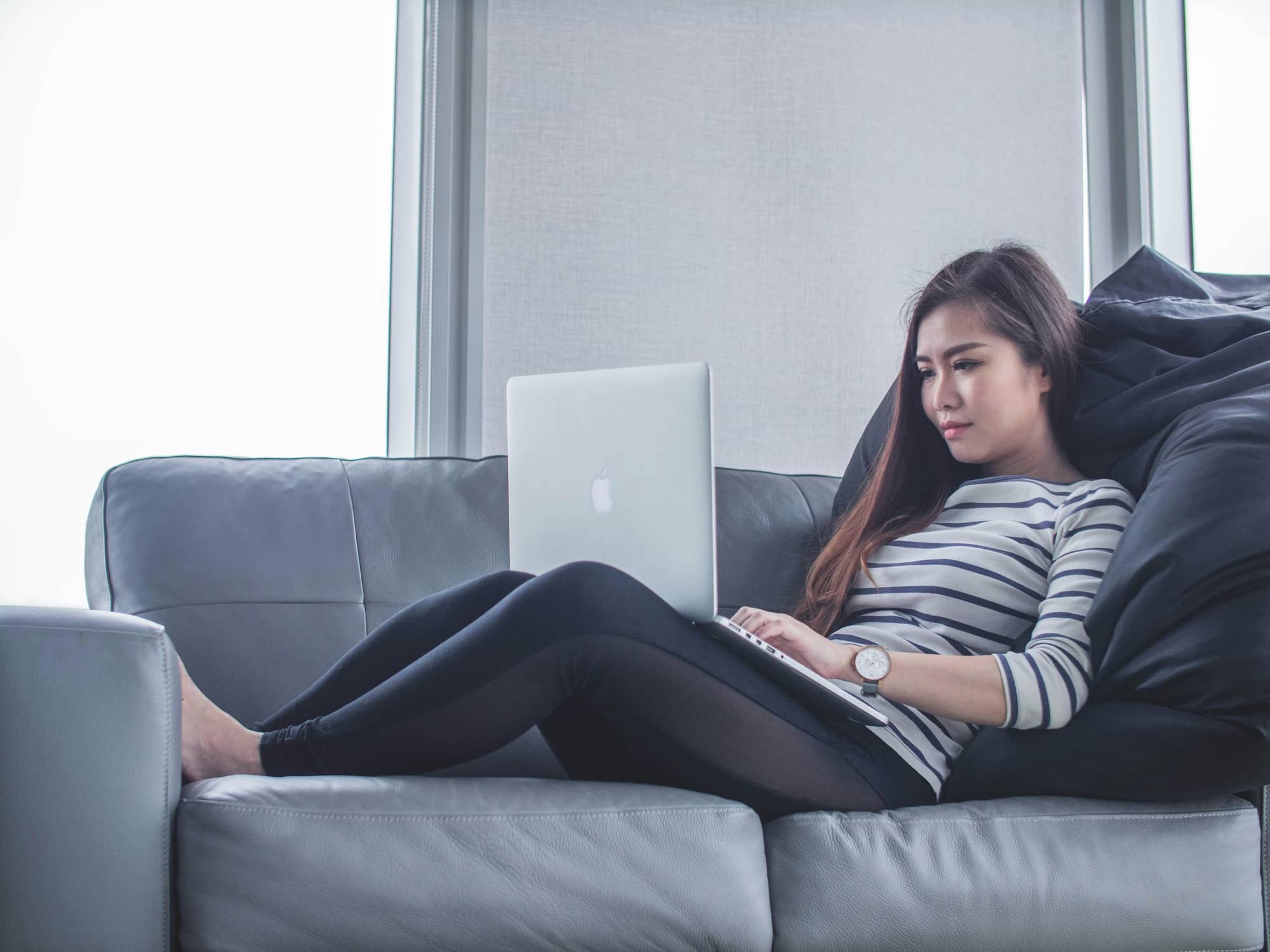 woman working on a laptop - Online Feedback Tools