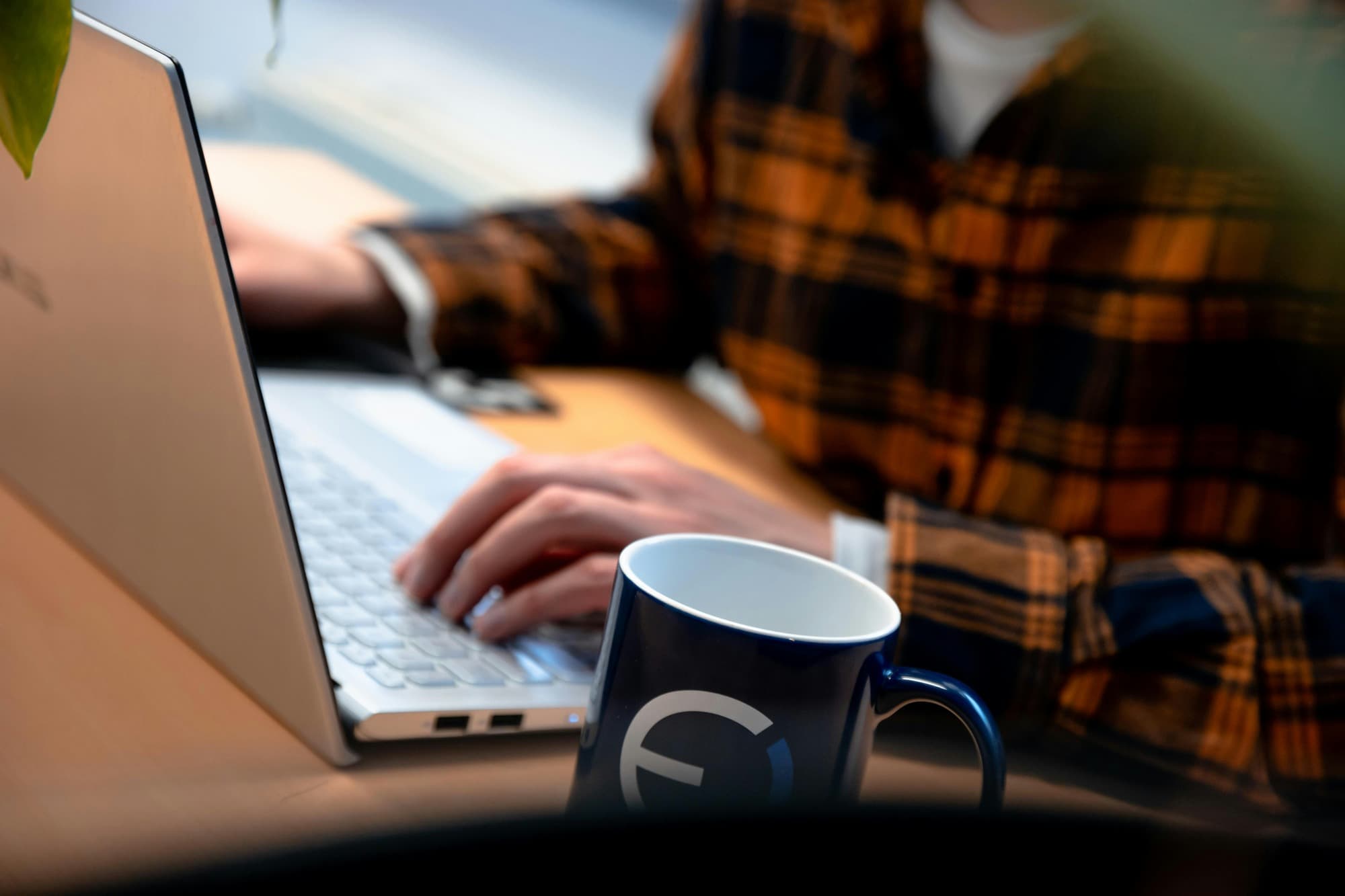 man working on laptop - AI in Assessment