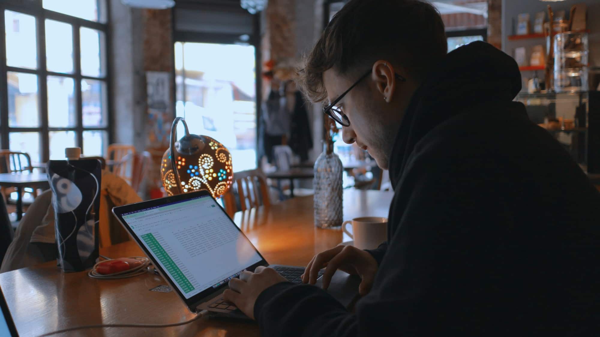 man wokring on laptop - AI Assessment Tools