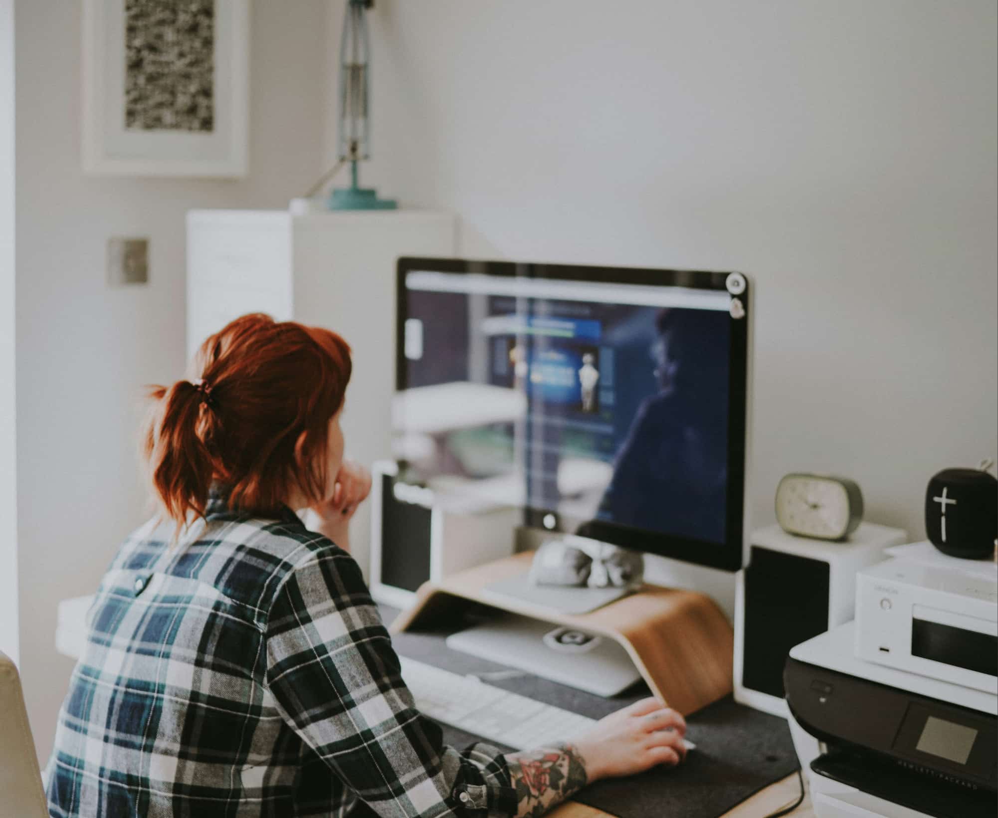 woman working on a laptop - Online Feedback Tools