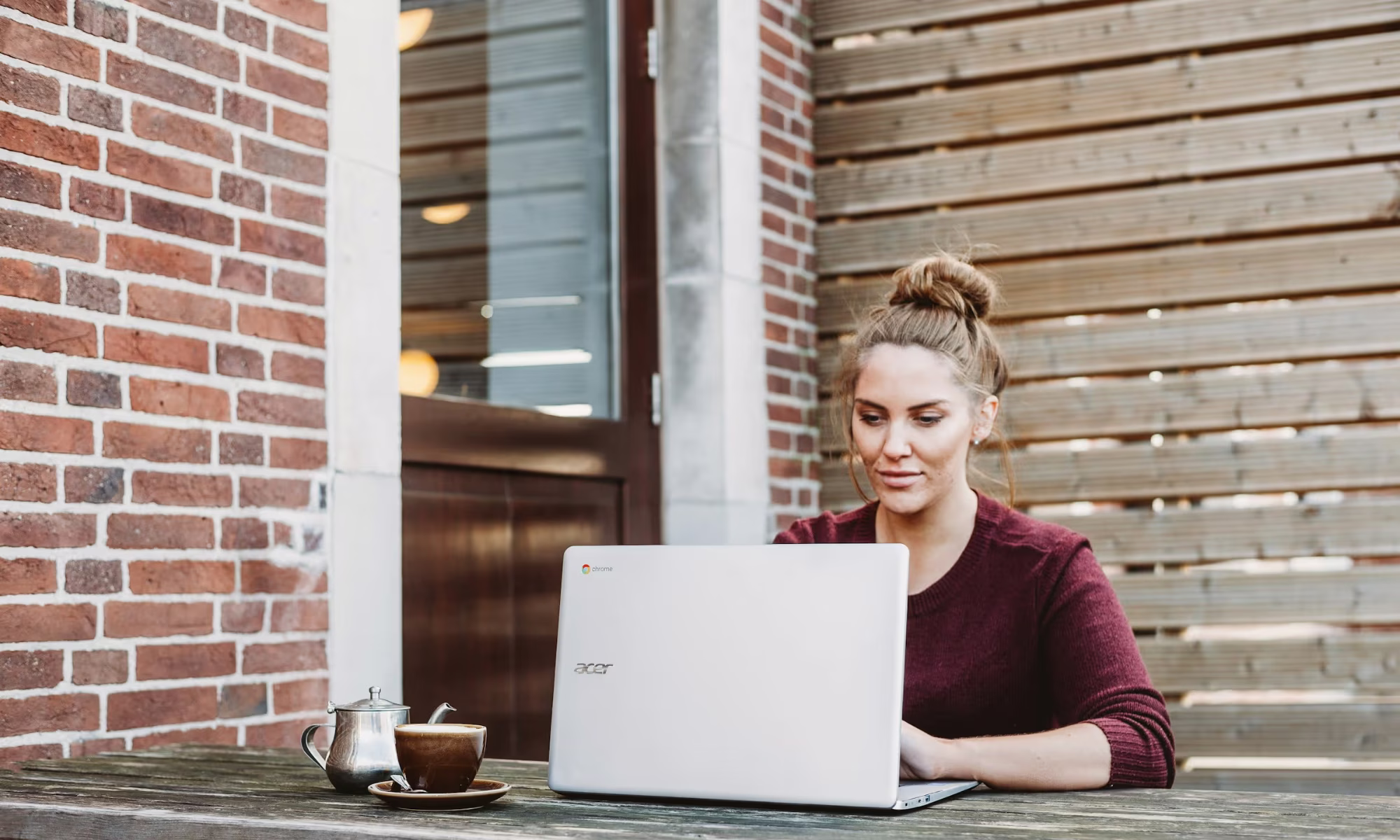 woman working on a laptop - What Are the Challenges of Using AI in a Classroom