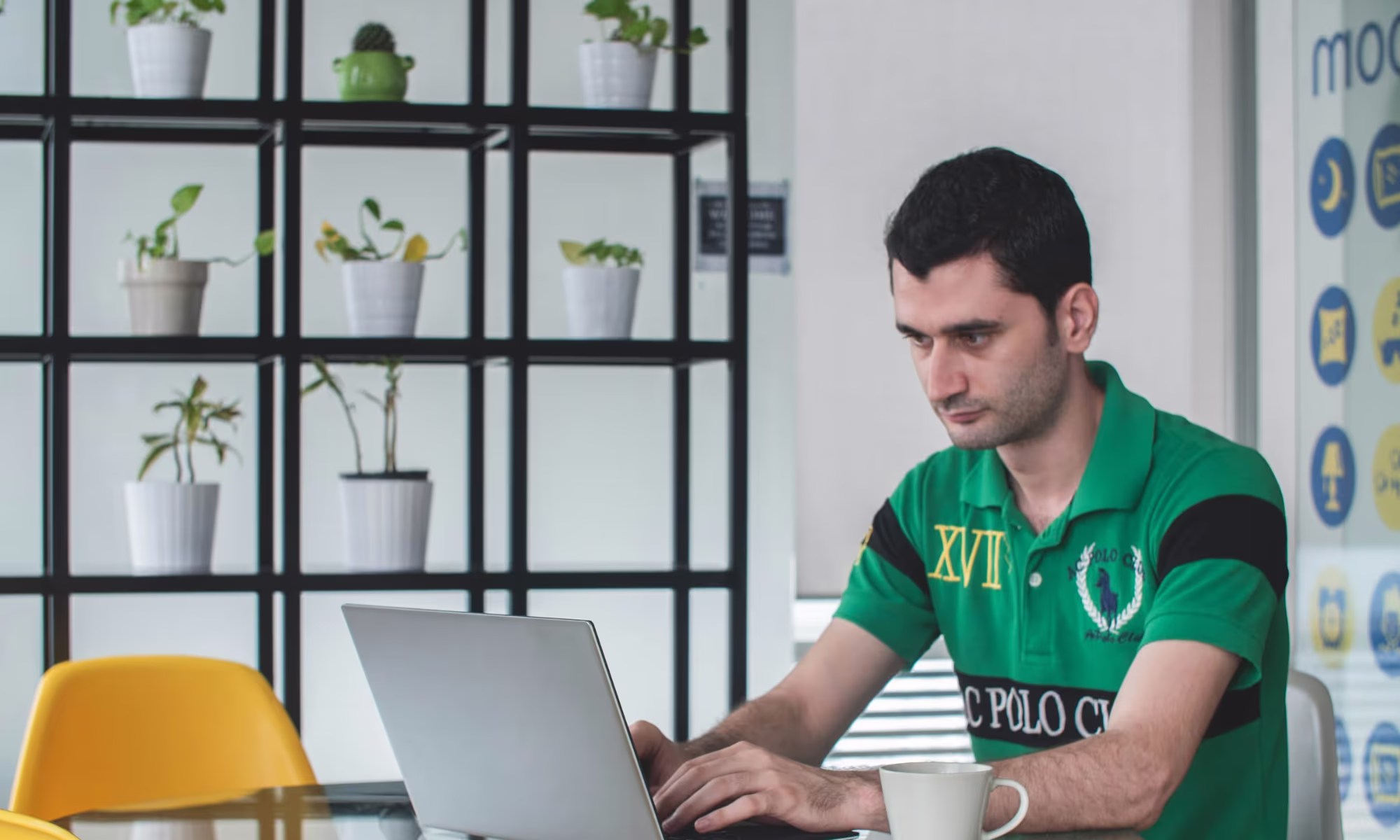 man working on a laptop - UPenn Supplemental Essays 