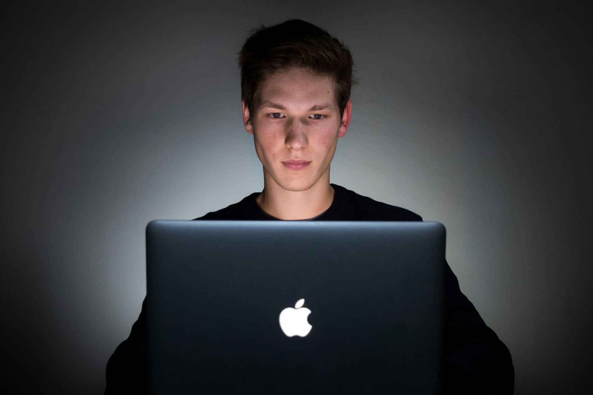 boy working on laptop - Types of Feedback for Students