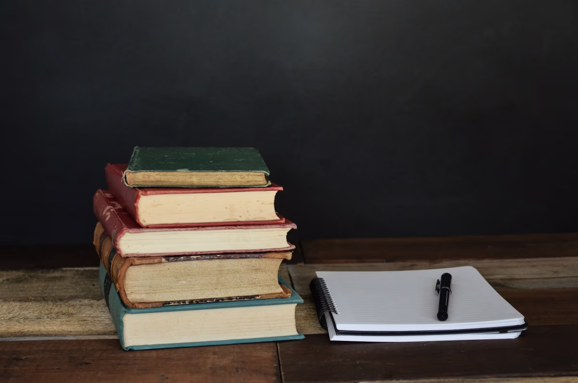 Books Laying on Table - Magic School AI