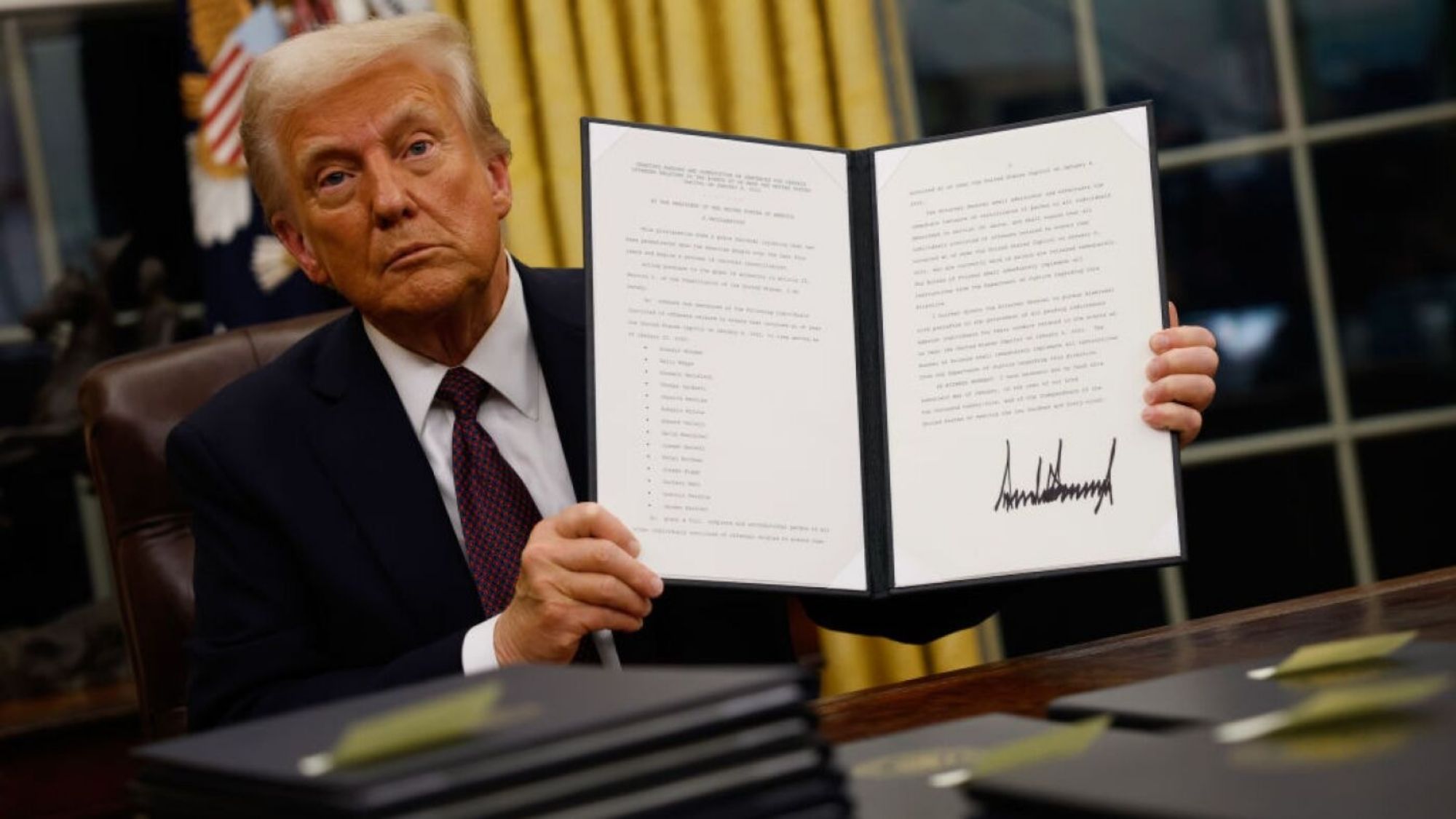 President Trump holding the executive order