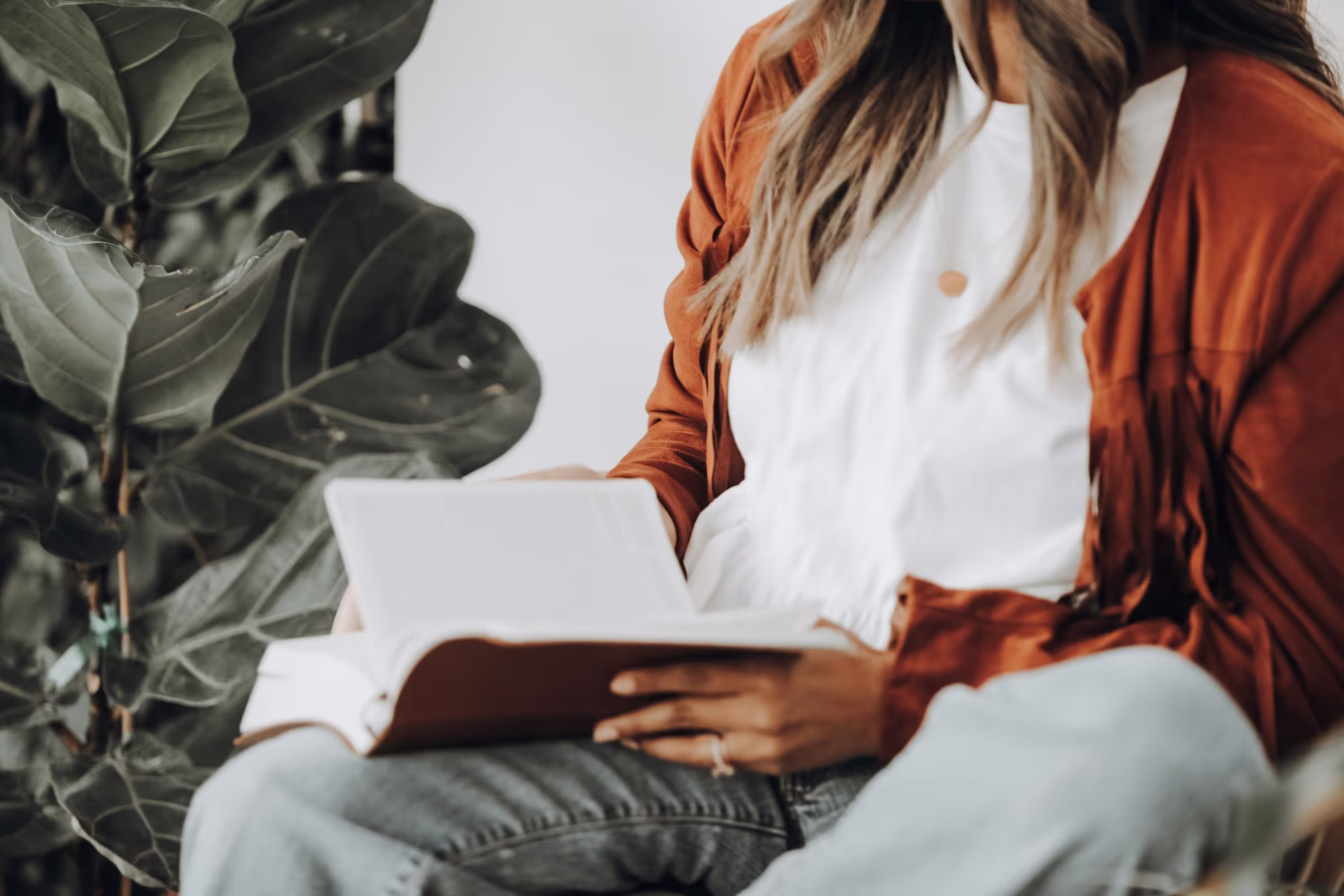 person with a book - Reading Comprehension Strategies