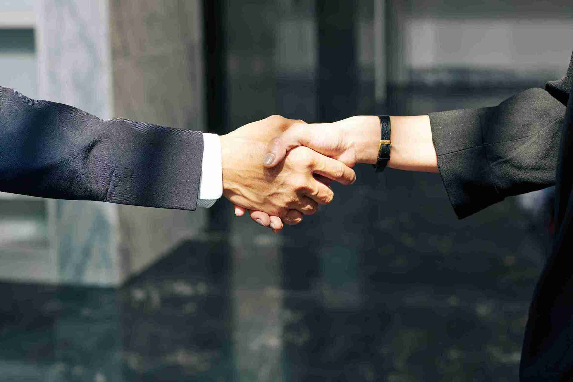 A successful partnership symbolized by a handshake, a key element in managing a high-risk business.