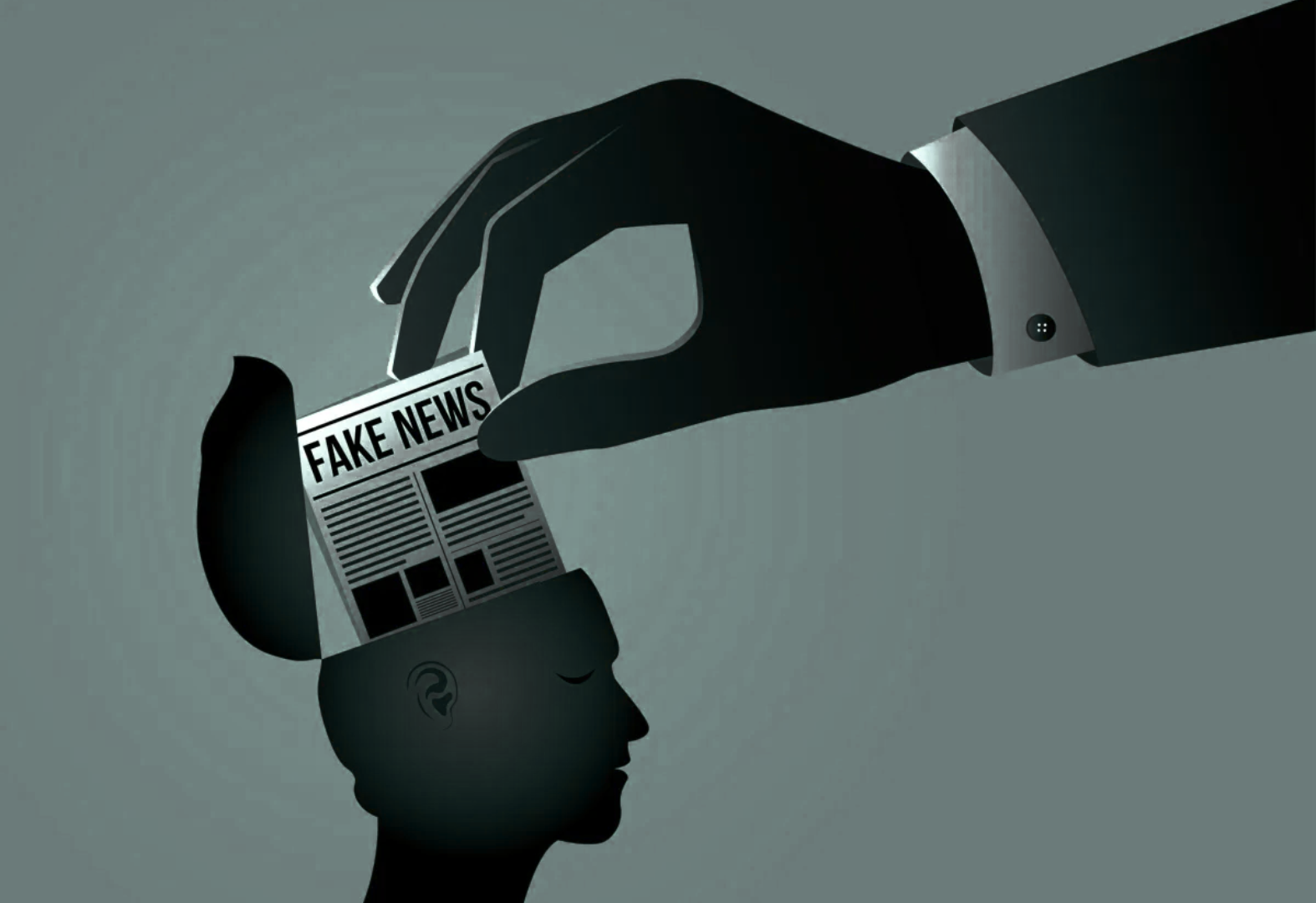 A hand deliberately putting fake news into a persons head