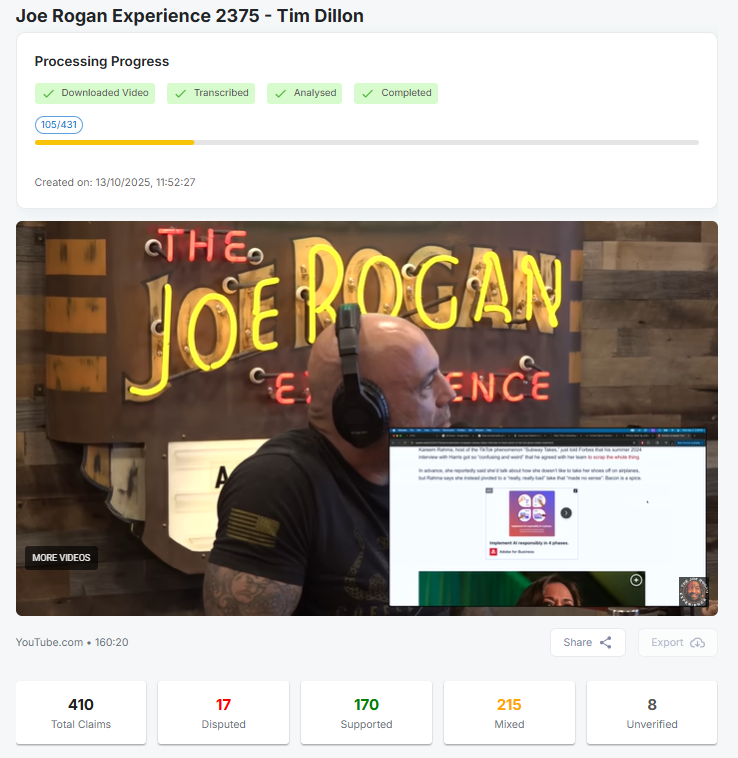 Joe Rogan wearing headphones in front of a neon sign that reads 'The Joe Rogan Experience' during a video podcast.