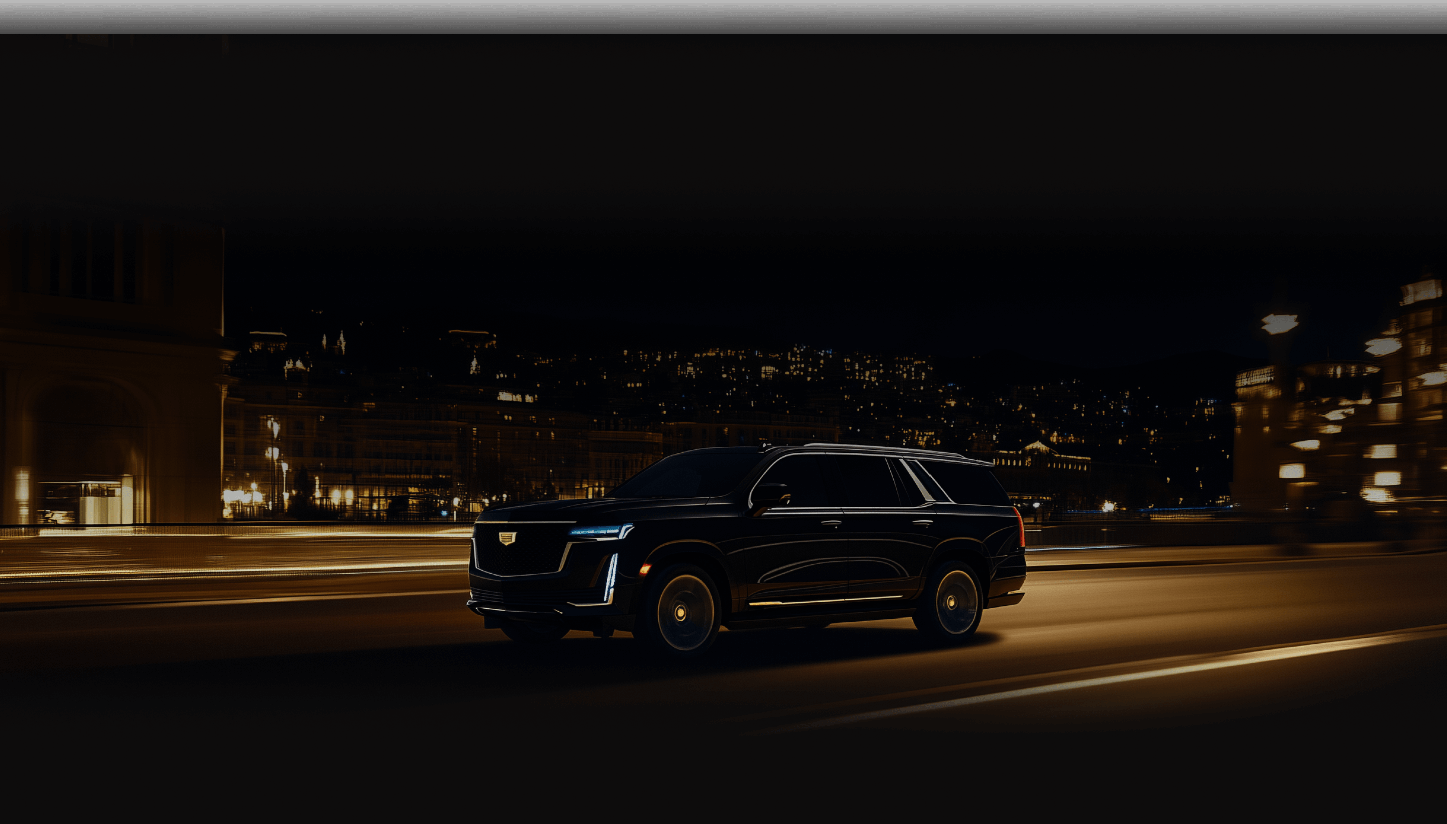 Night Miami Cadillac Escalade ESV black is causing down the highway.