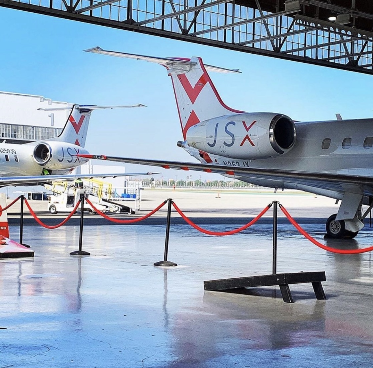 JSX private jet with logo visible on the tail, highlighting luxury travel with professional limo service to JSX Opa Locka.