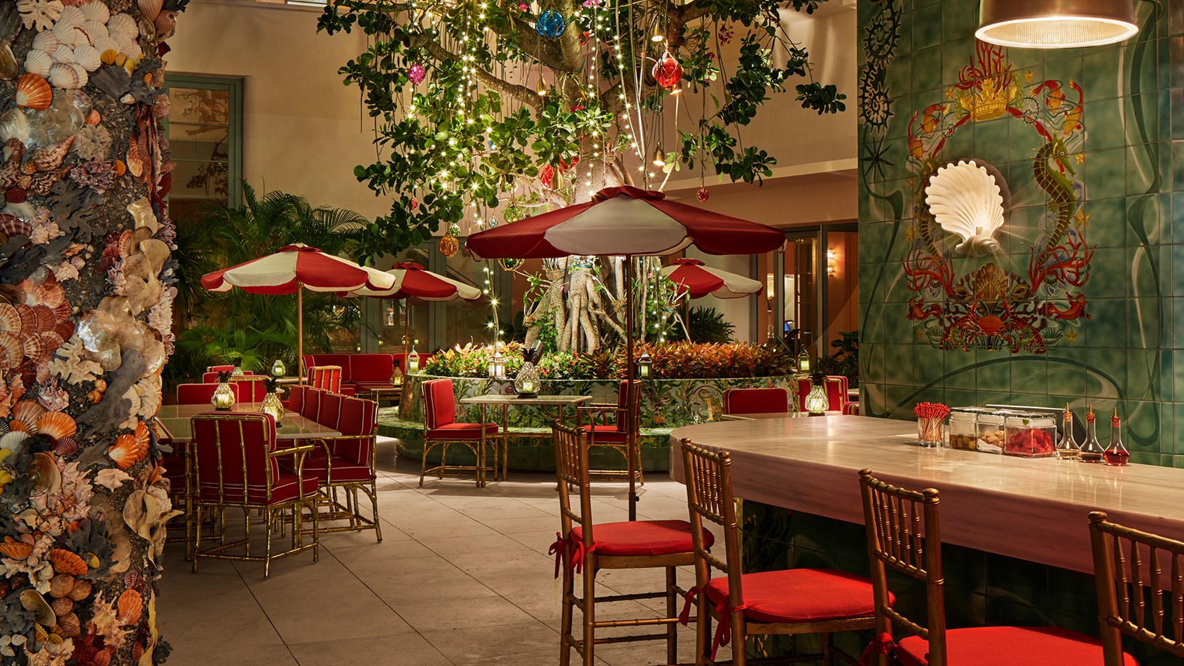 Faena bar in the evening light with a beautiful tree with lights.