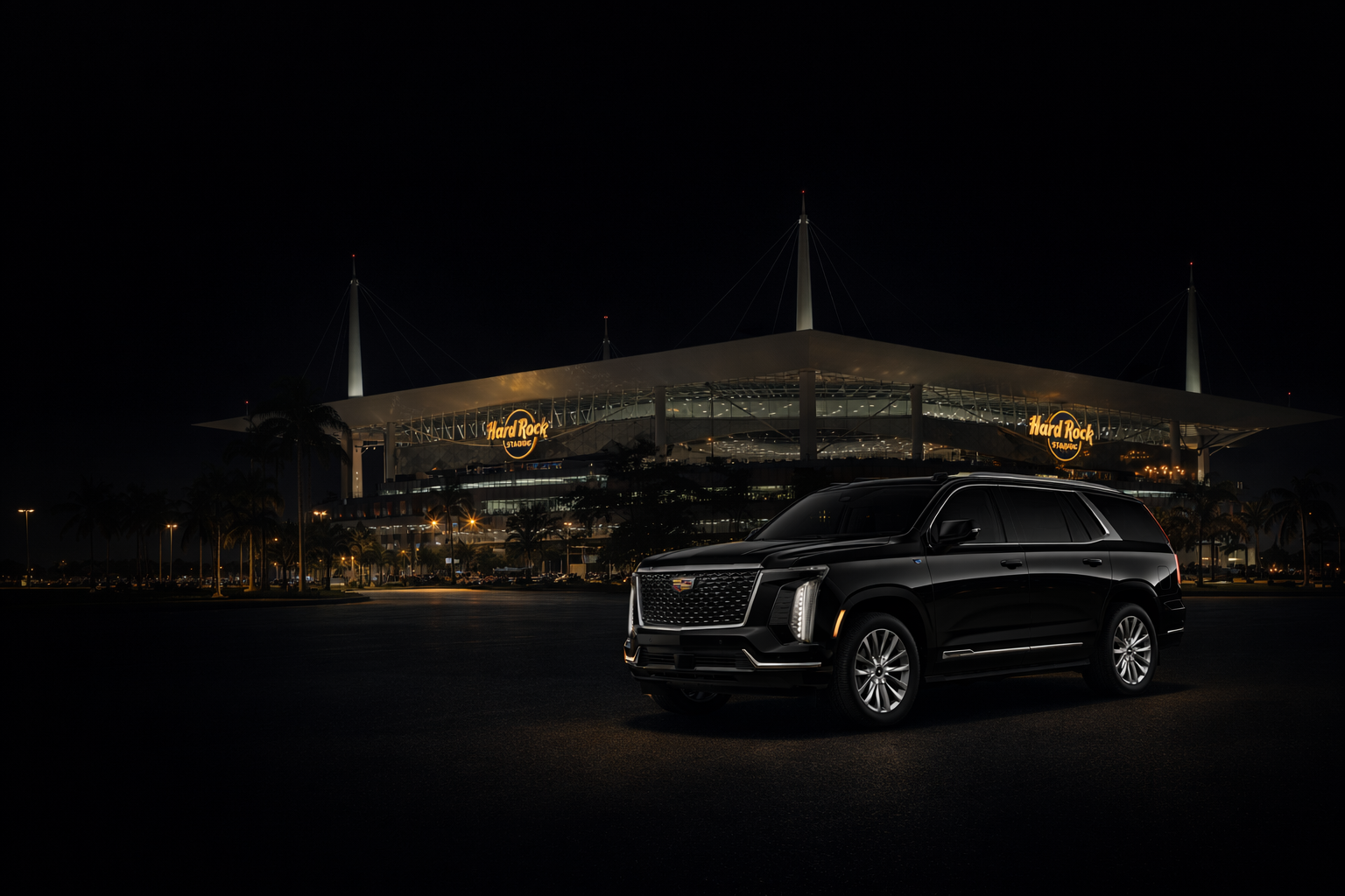 Miami Choice Limo black 2025 Cadillac Escalade parked at Hard Rock Stadium at night in Miami, luxury SUV chauffeur service for airport transfers and corporate travel