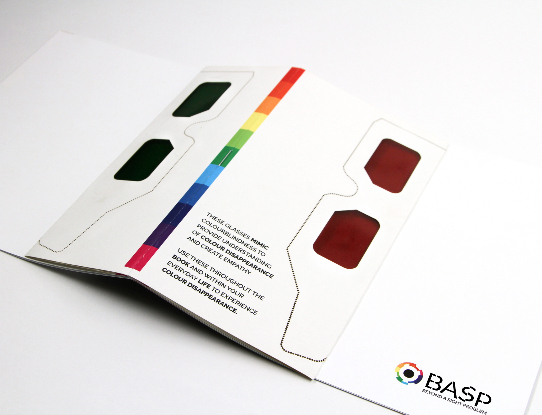 Front of the brochure displaying the perforated glasses included.