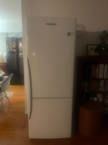 White refrigerator with a bottom freezer.