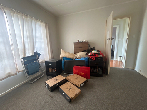 chair, boxes, pillows, dresser, bags, door