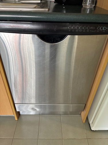 Stainless steel dishwasher with control panel.