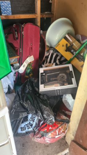 Red suitcase, black garbage bag, white bowl, boxed item, striped bag.