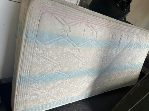 Mattress with floral pattern and blue accents.