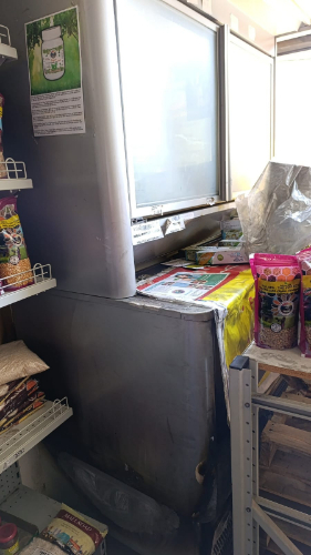 Refrigerator, bags of food, shelves.