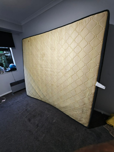 Large, folded mattress with a honeycomb pattern.