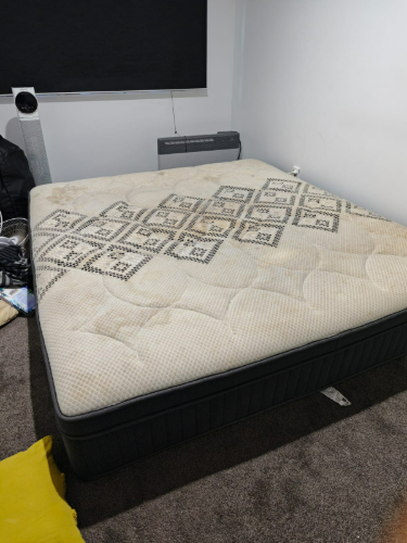 Queen-sized mattress with patterned fabric.