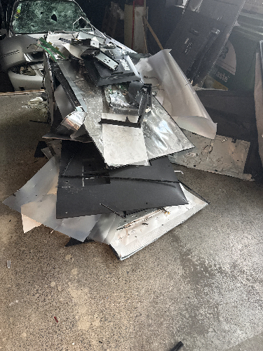 Pile of metal sheets and scraps.