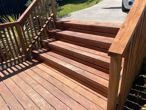Wooden steps with railings.