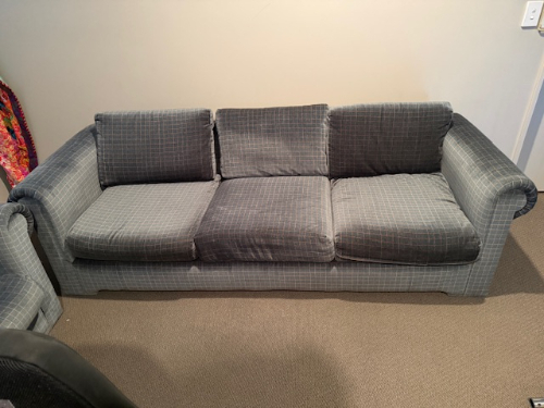 Gray plaid three-cushion sofa.
