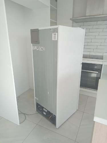 Refrigerator with a "Cyclopentane" label.