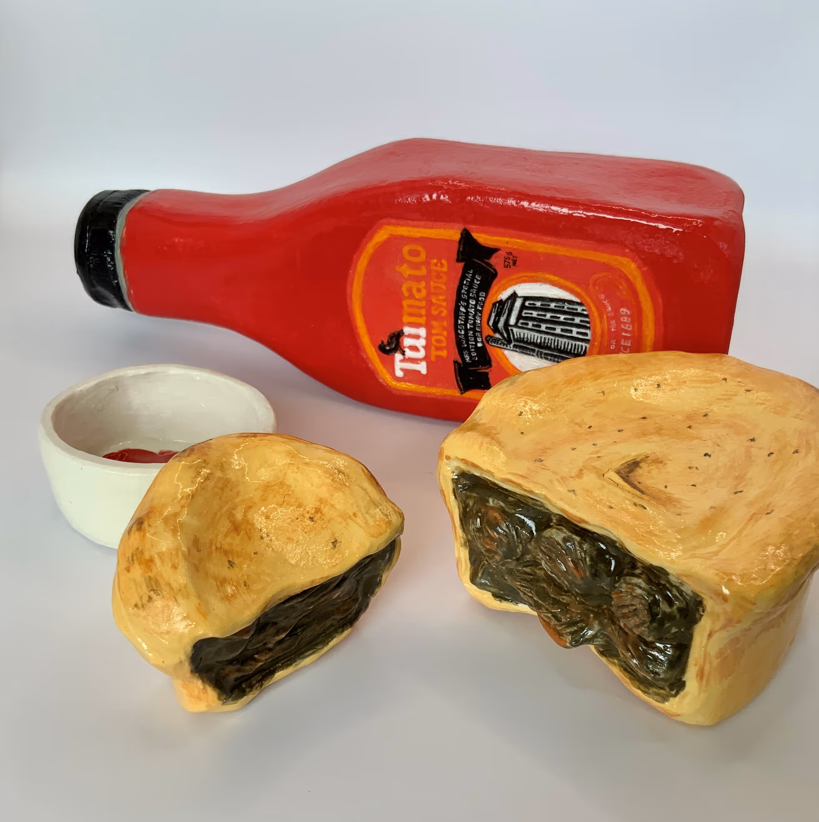 'Pie & Sauce'  (Tomato sauce 21 x 8 x 4 Cup of tomato sauce 6 X 2.5 Pie 9 X 8.3 cm