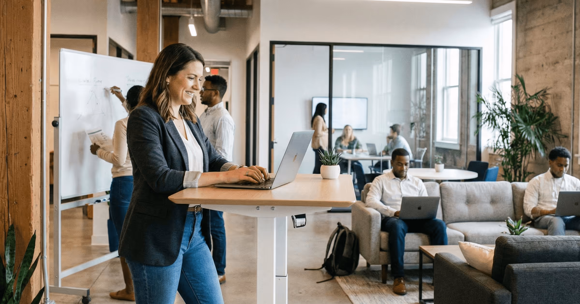An employee in a modern office taking training on a learning management system.