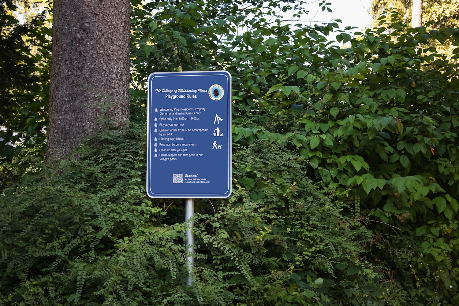 Custom playground rules sign designed by Longitude Planning Group for the Village of Whispering Pines, North Carolina, as part of a unified parks and trails wayfinding and signage program.