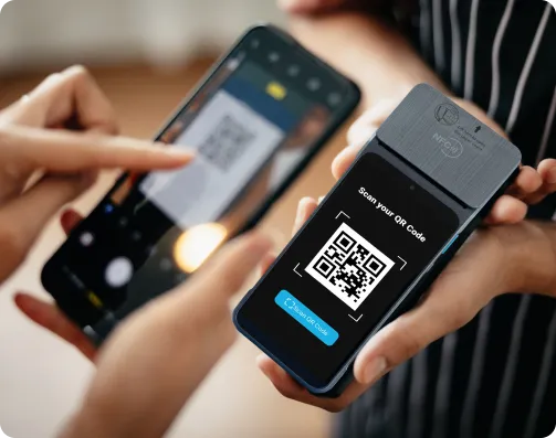 Customer scanning a QR code on a Payflo handheld terminal with a phone