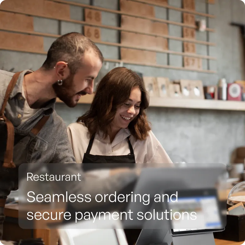Restaurant staff taking an order on the Payflo POS terminal